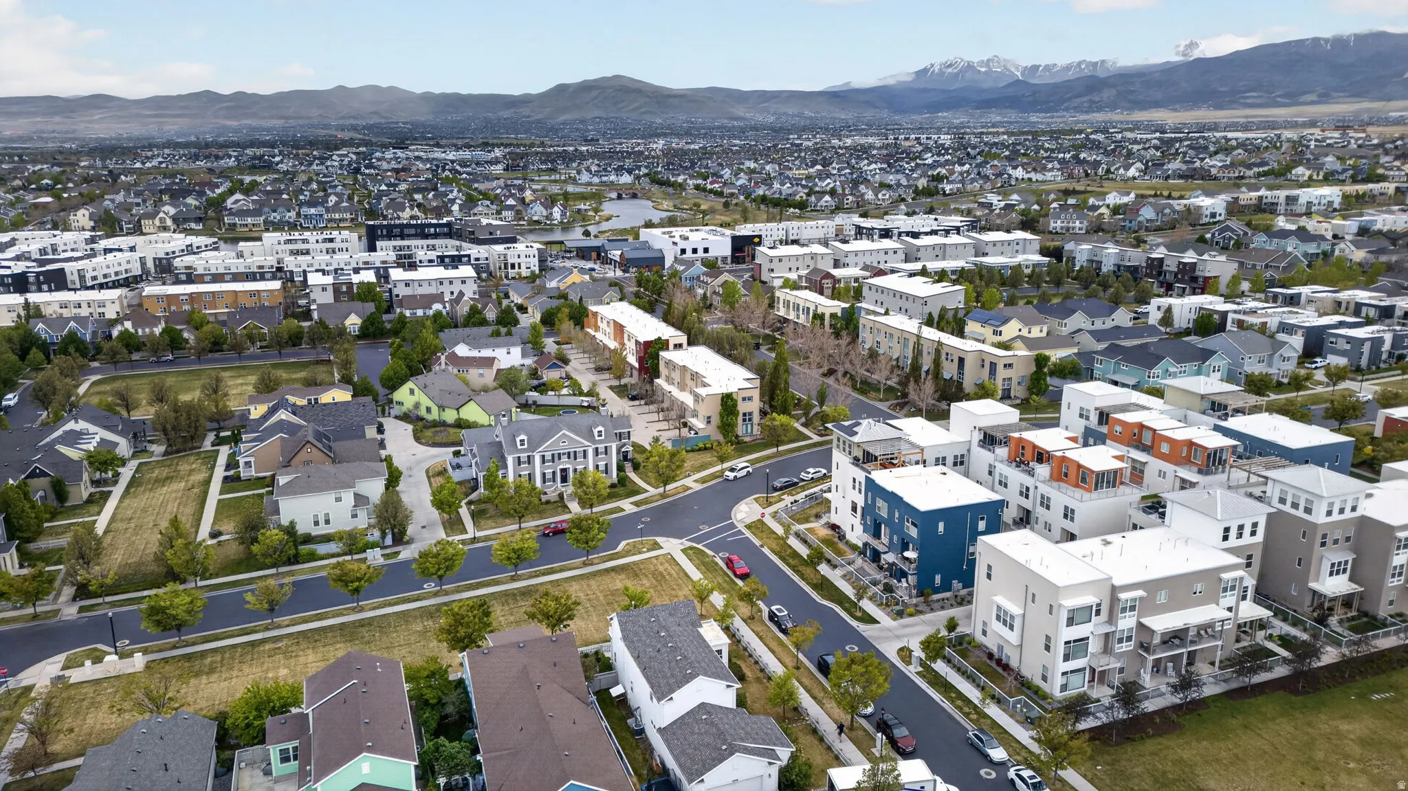 Expansive aerial overview showcasing a diverse residential community with varied architectural styles