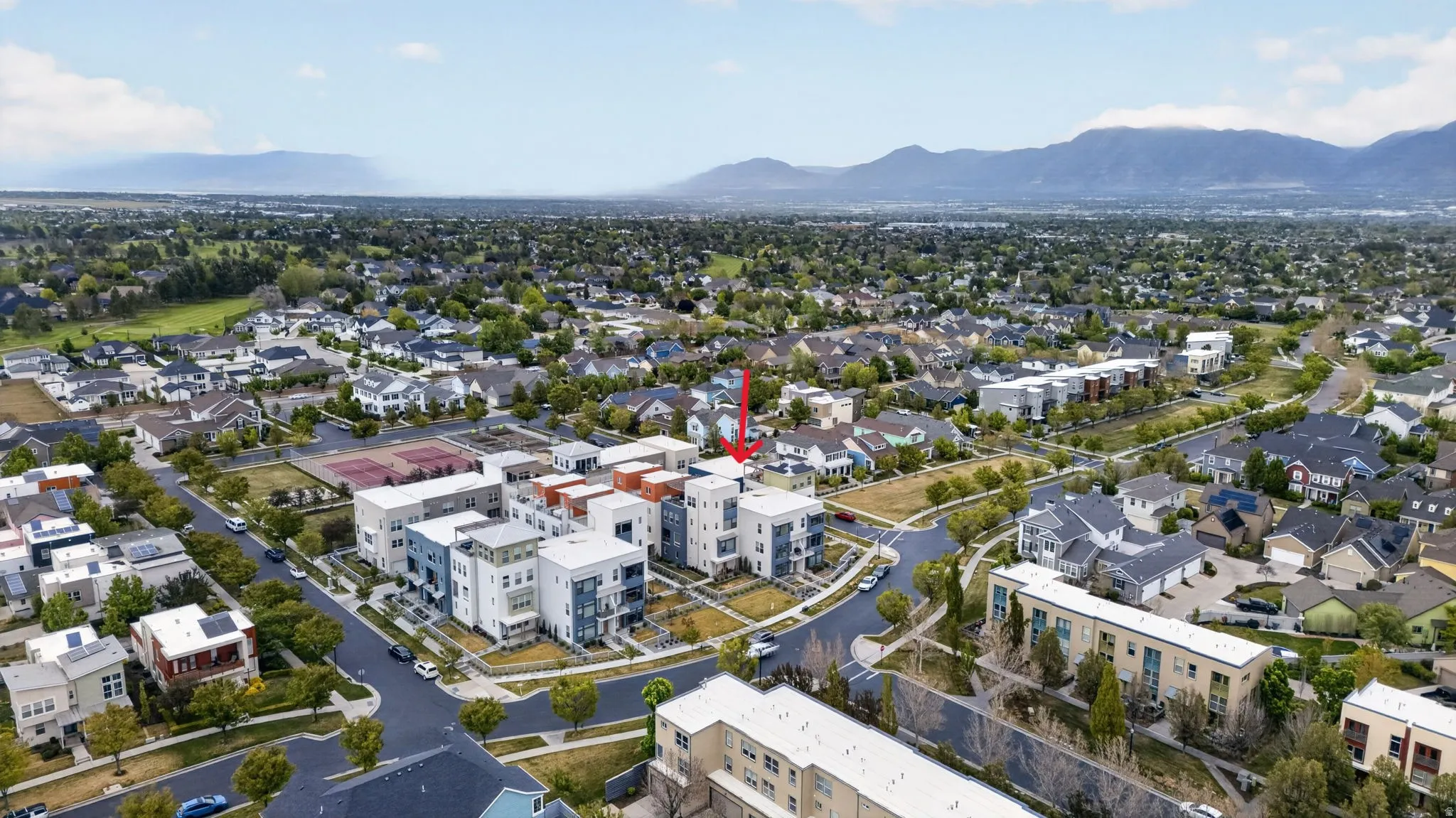 Aerial perspective showcasing a developed residential area with a mix of housing styles