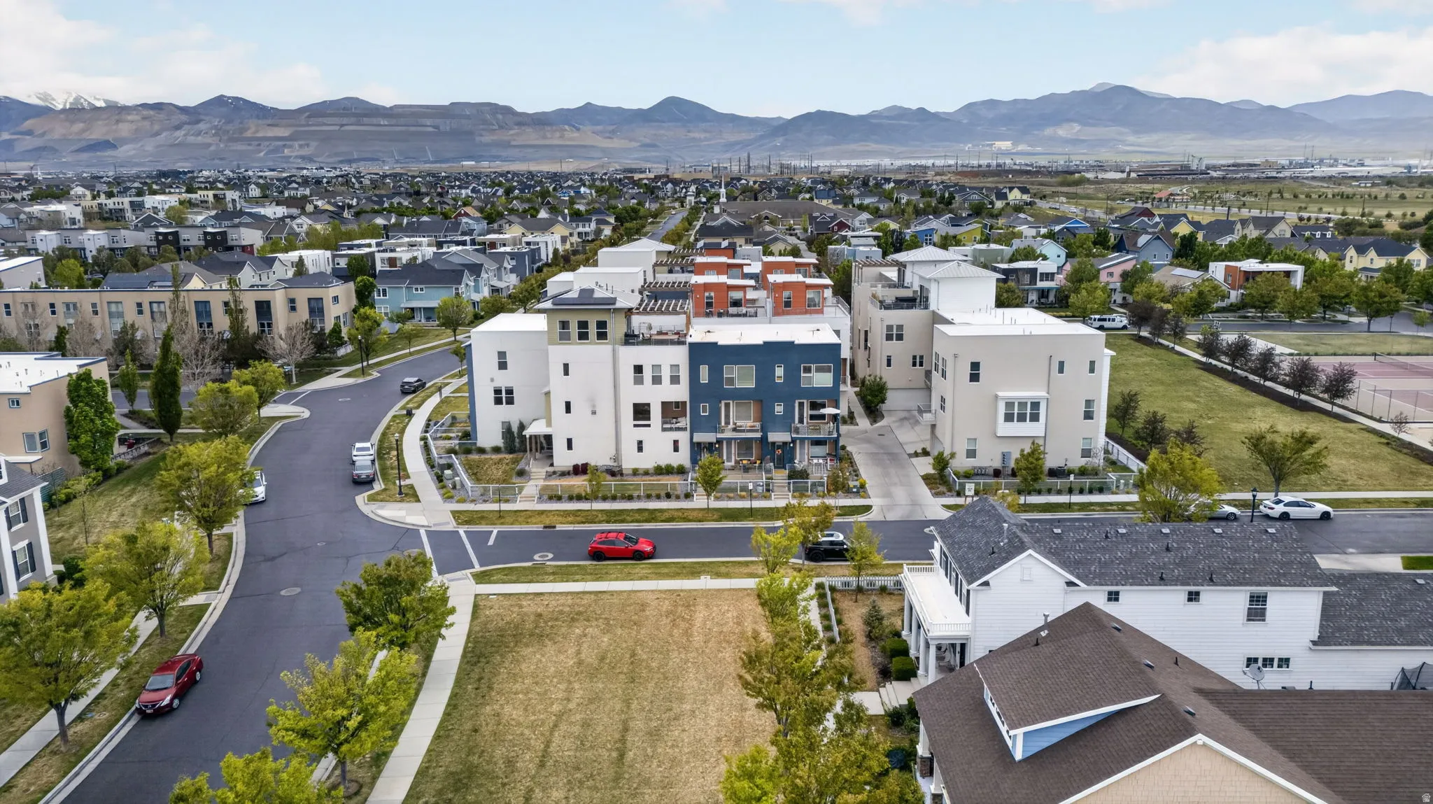 Contemporary multi-story residences featuring varied facades and rooftop terraces