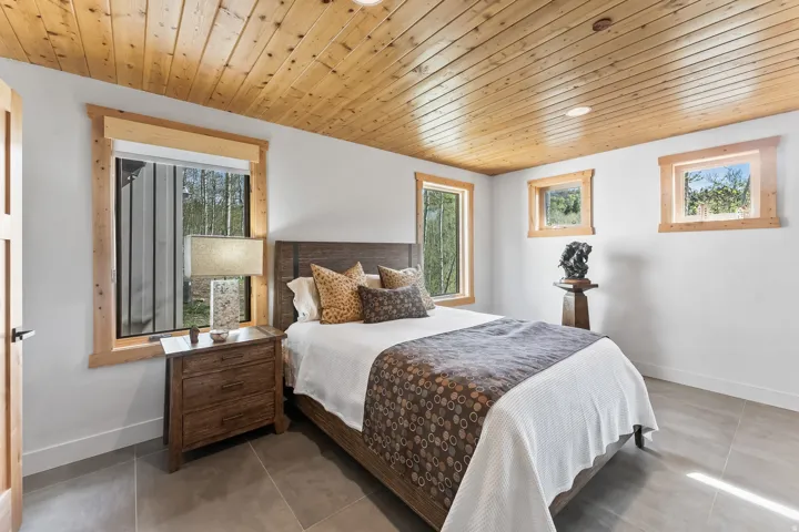 Slatted wood ceiling featuring recessed lighting