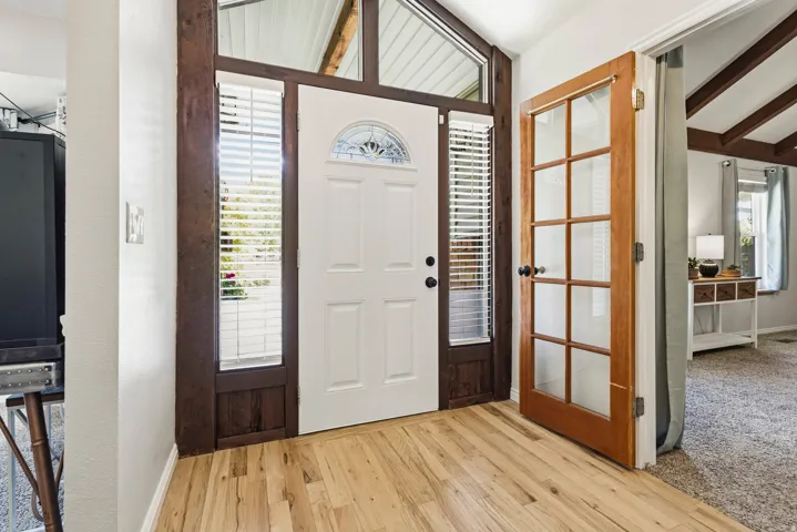 Entryway featuring natural wood-finish flooring