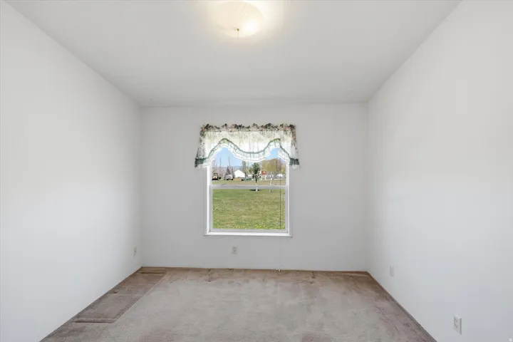 Neutral wall finishes with a single window