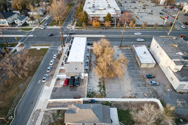 Newly constructed multi-level building featuring a flat roof and modern gray facade