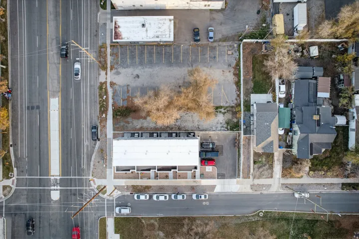Aerial perspective showcasing a corner property with direct street frontage