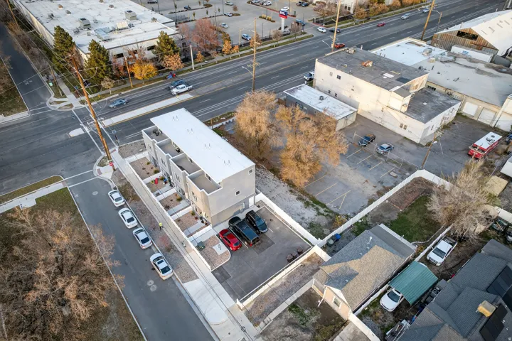 Contemporary multi-unit property featuring a flat roofline and a neutral-toned exterior