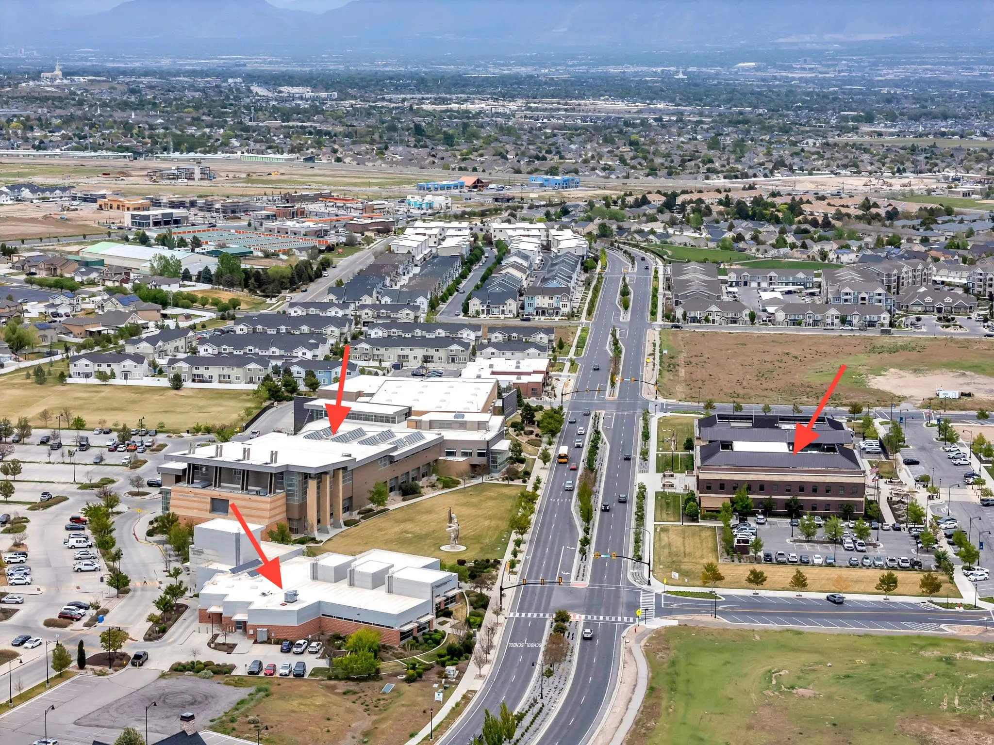 Aerial perspective showcasing a developed neighborhood with multiple commercial structures and residential areas