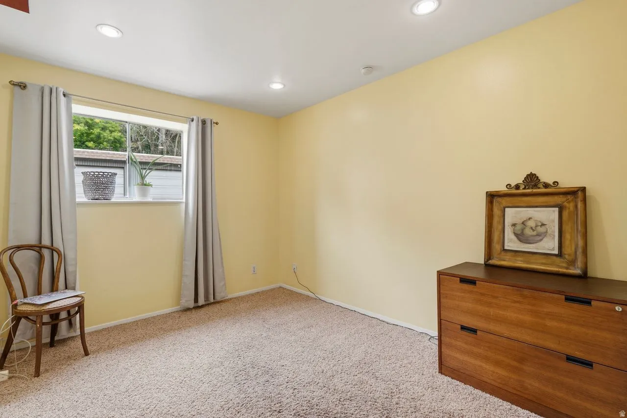 2nd Bedroom featuring carpet flooring, recessed lighting, neutral wall tones, and a large window with great natural light & walk in closet.