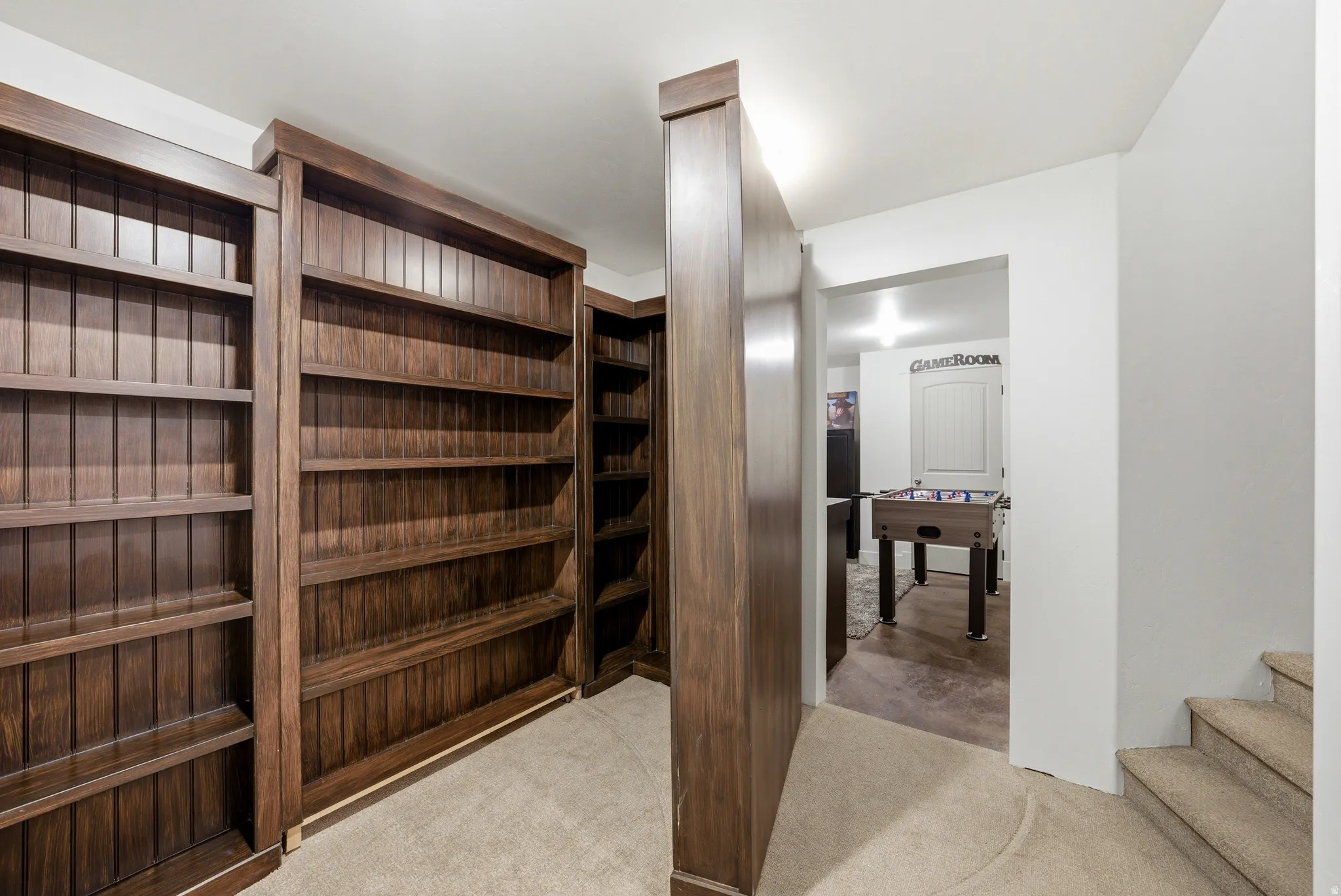 Built-in wood shelving units with a rich finish