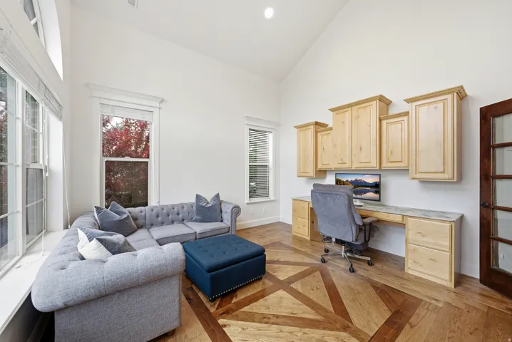 Vaulted ceilings complement the custom-designed wood-finish flooring