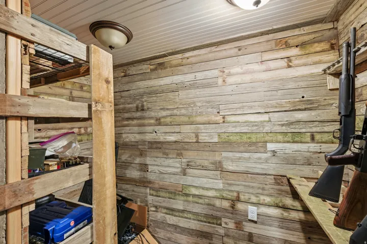 Interior space featuring rustic wood paneling