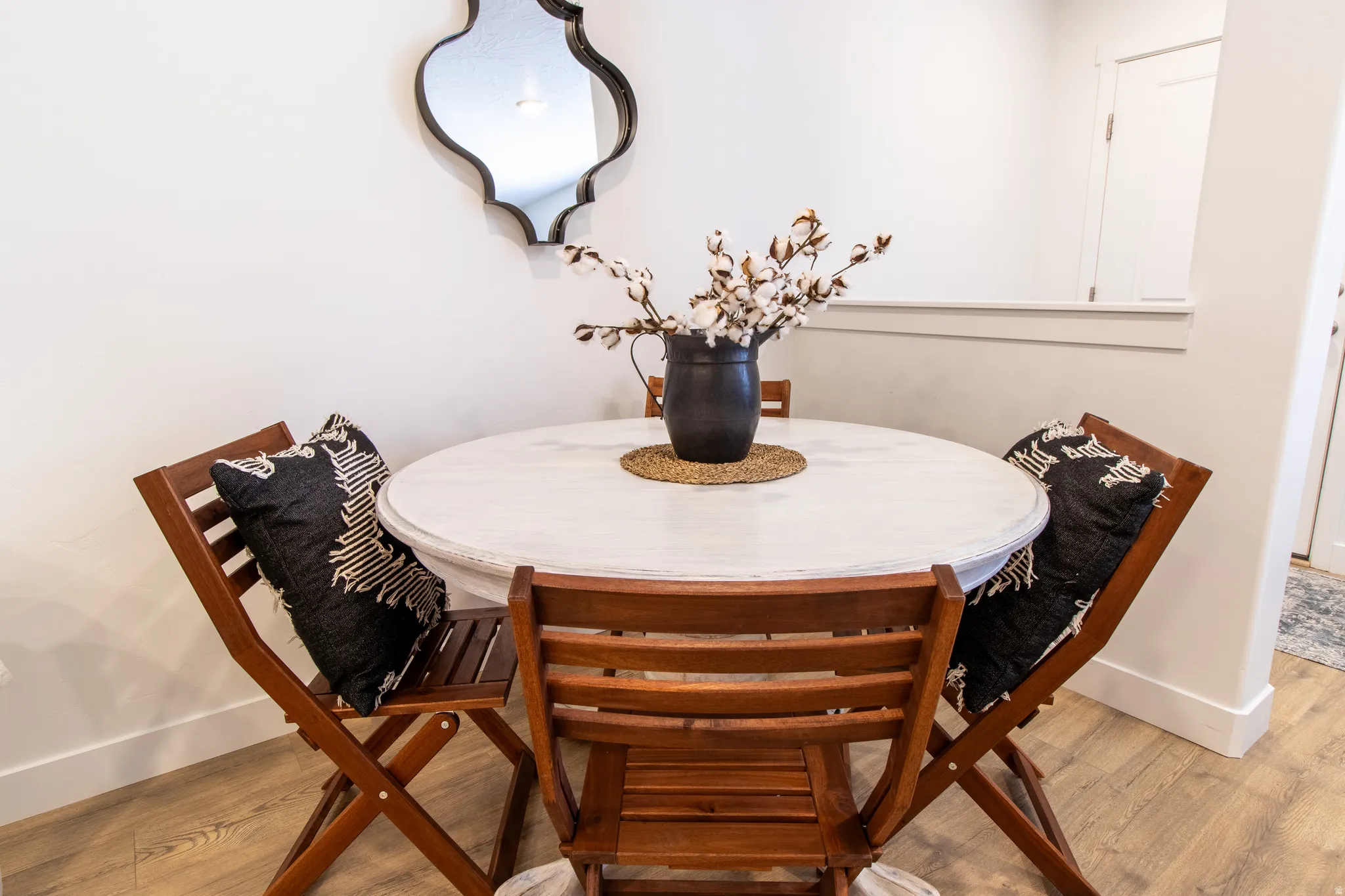 Cozy dining area  with extensive baseboard , premium laminate flooring