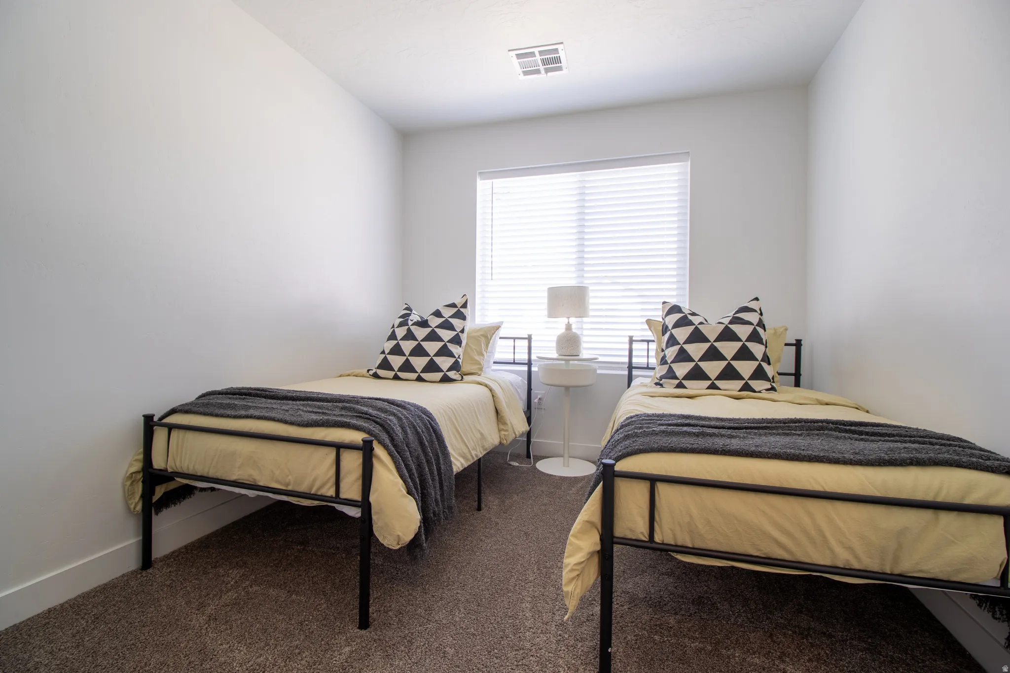 Good size bedroom with large window for natural light, high quality vinyl blinds, walk in closet.