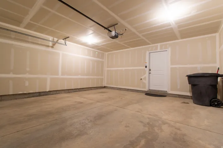 Spacious garage featuring concrete flooring,