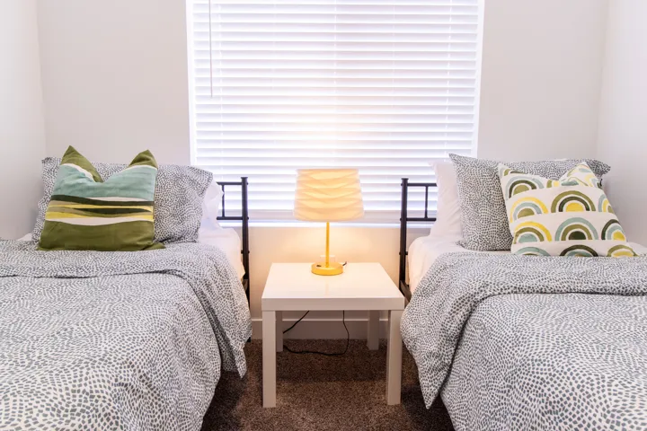Good size bedroom with large window for natural light and high quality vinyl blinds