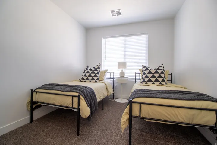 Good size bedroom with large window for natural light, high quality vinyl blinds, walk in closet.
