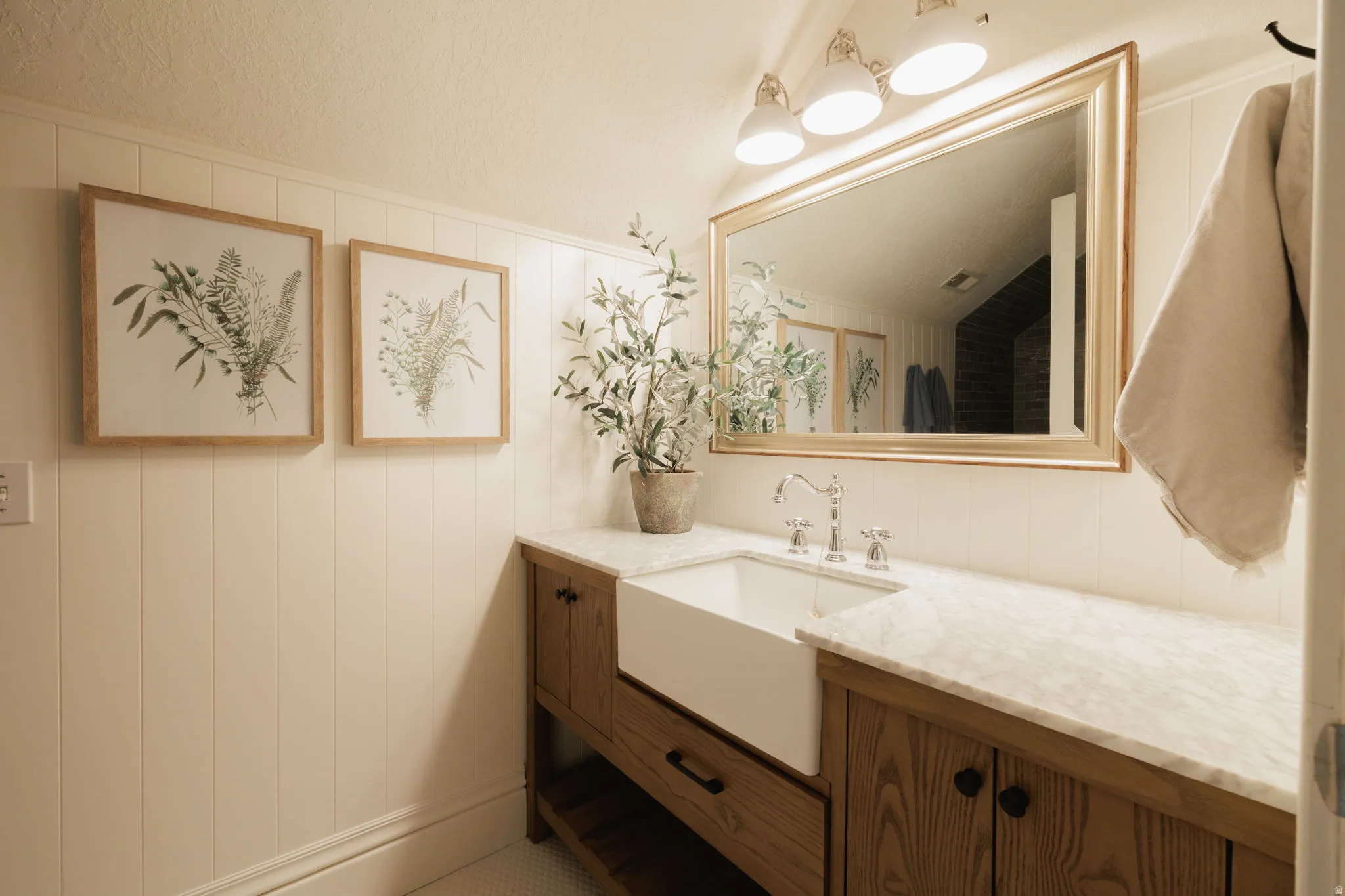 Bathroom with vanity and wooden walls