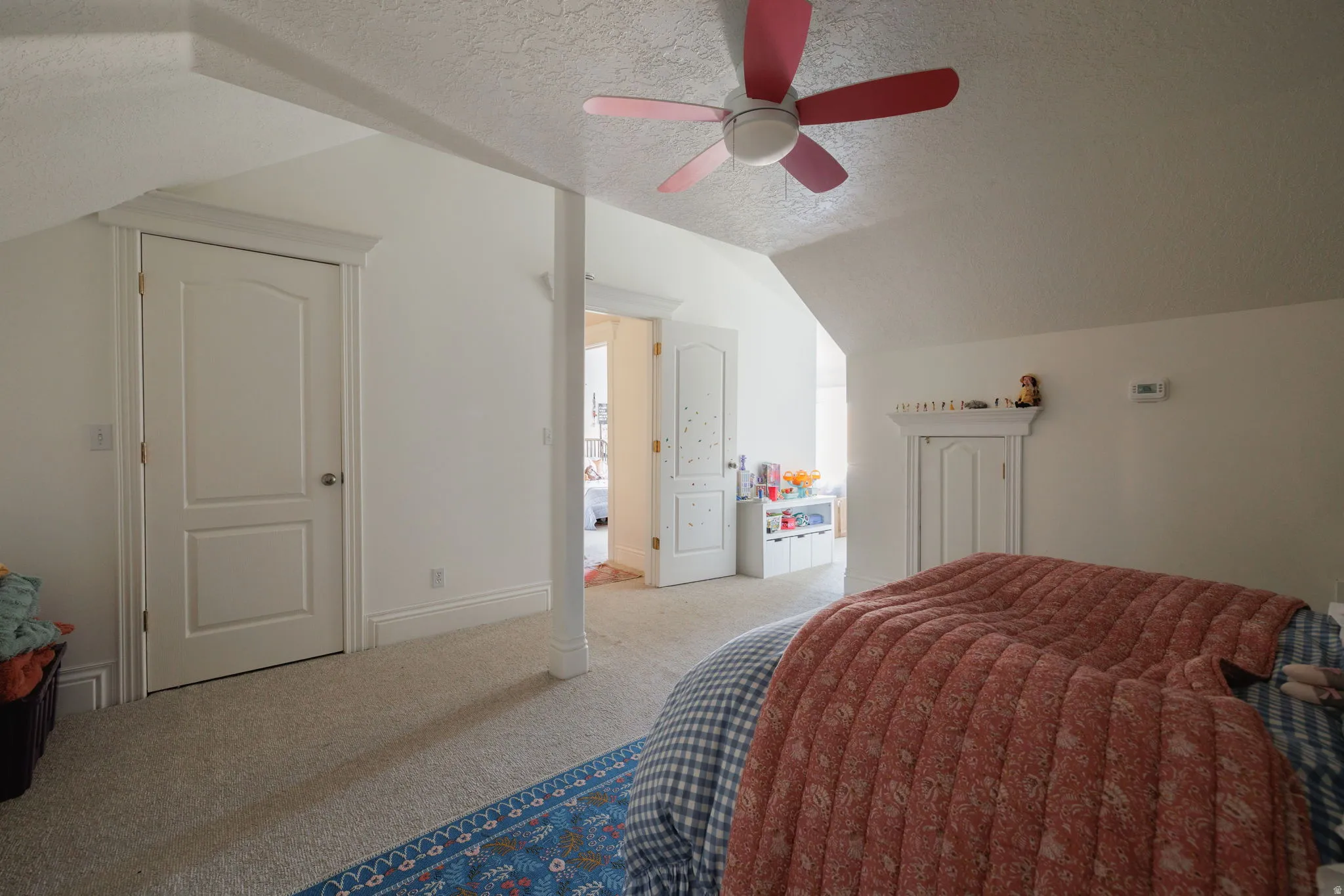 Bedroom featuring carpet flooring and ceiling fan