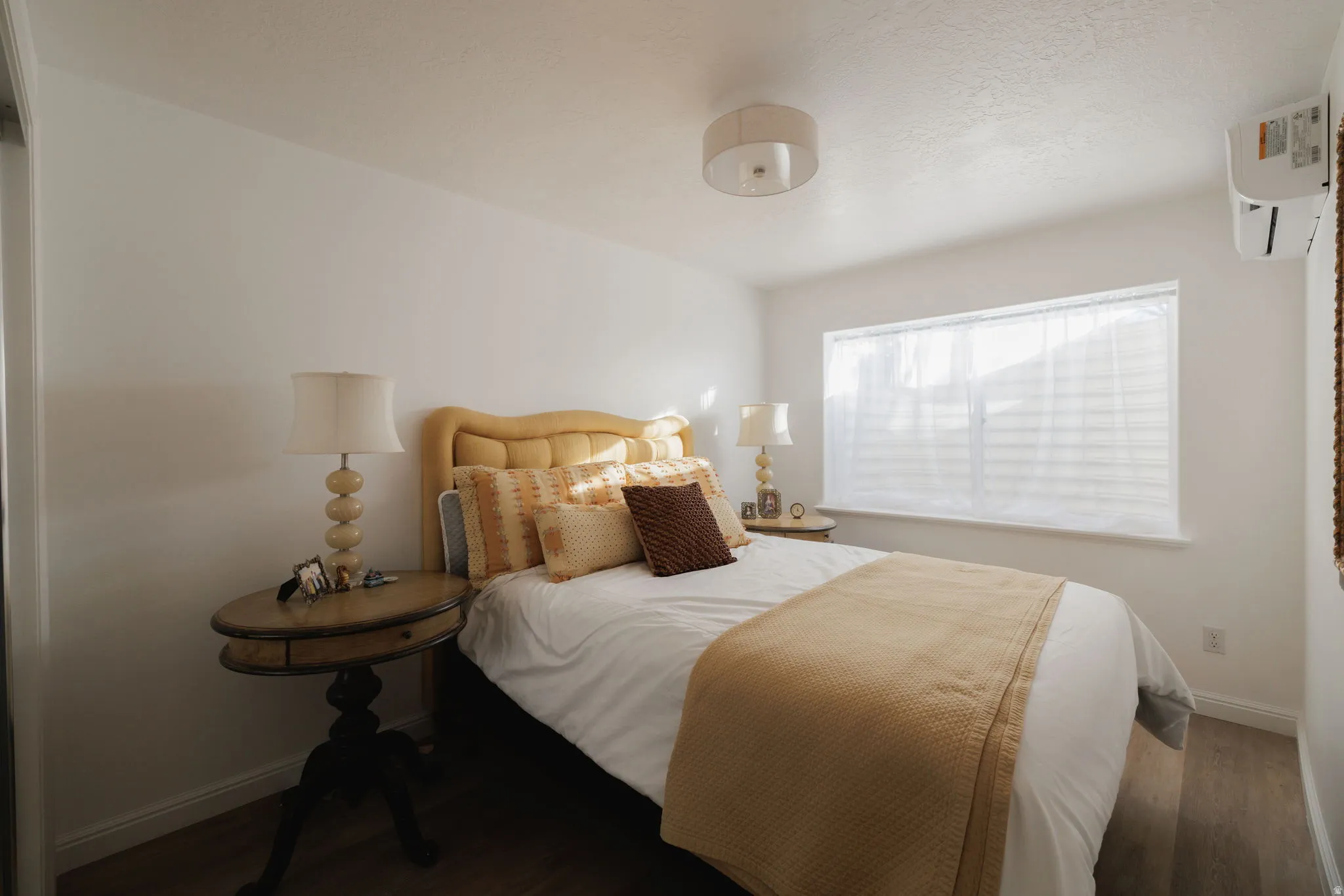 Bedroom with wood finished floors