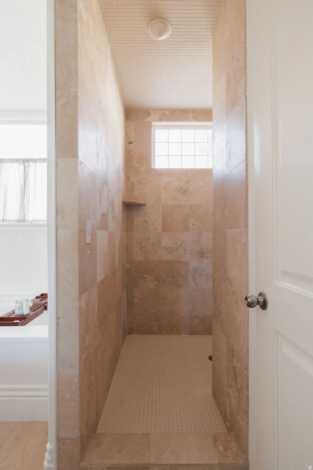 Full bath with a tile shower