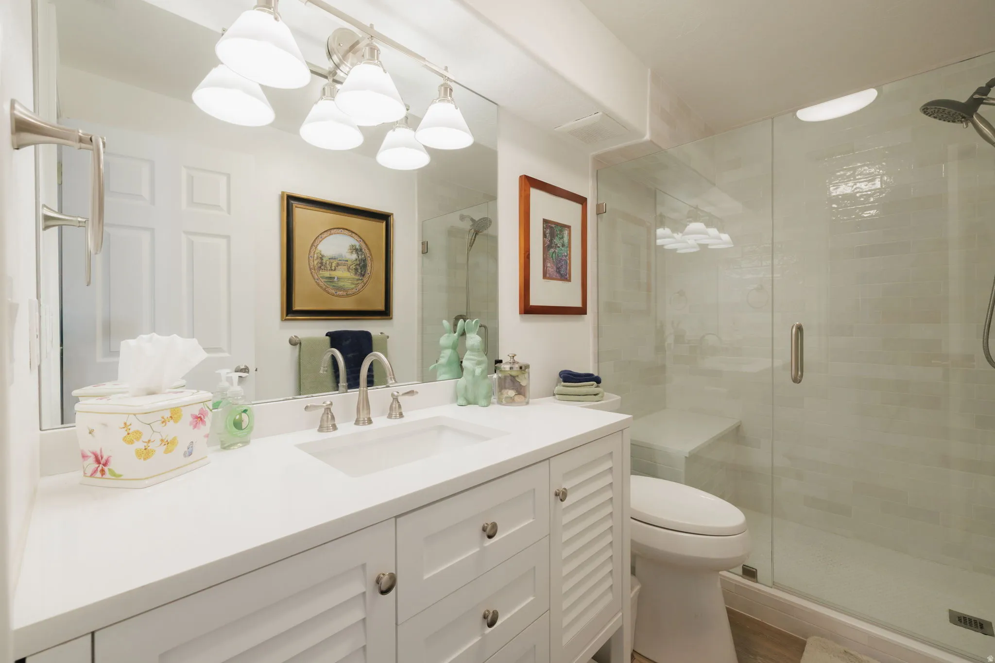 Bathroom with vanity and a stall shower