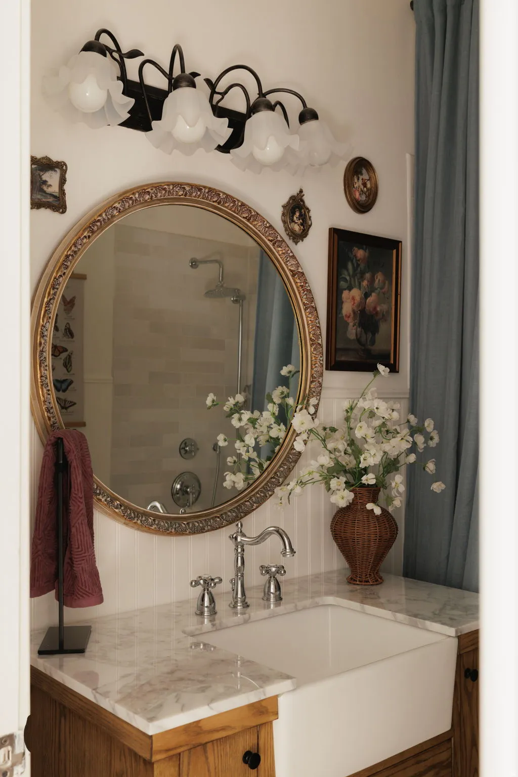 Bathroom with vanity and tiled shower