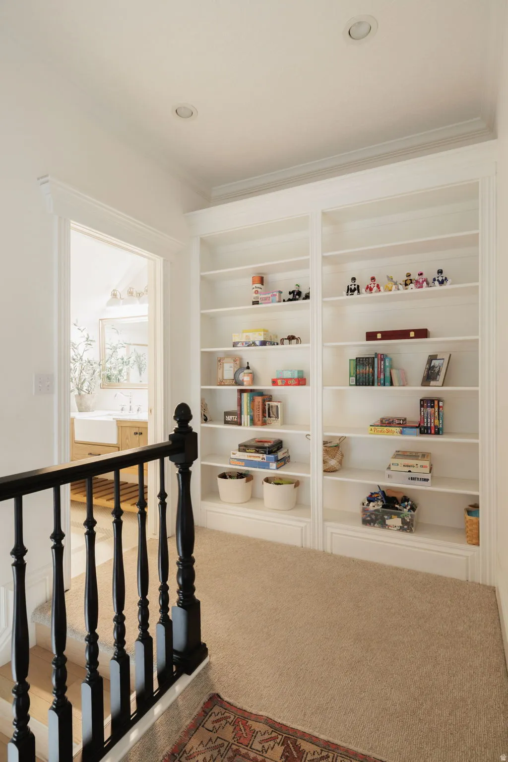Stairs featuring carpet and crown molding