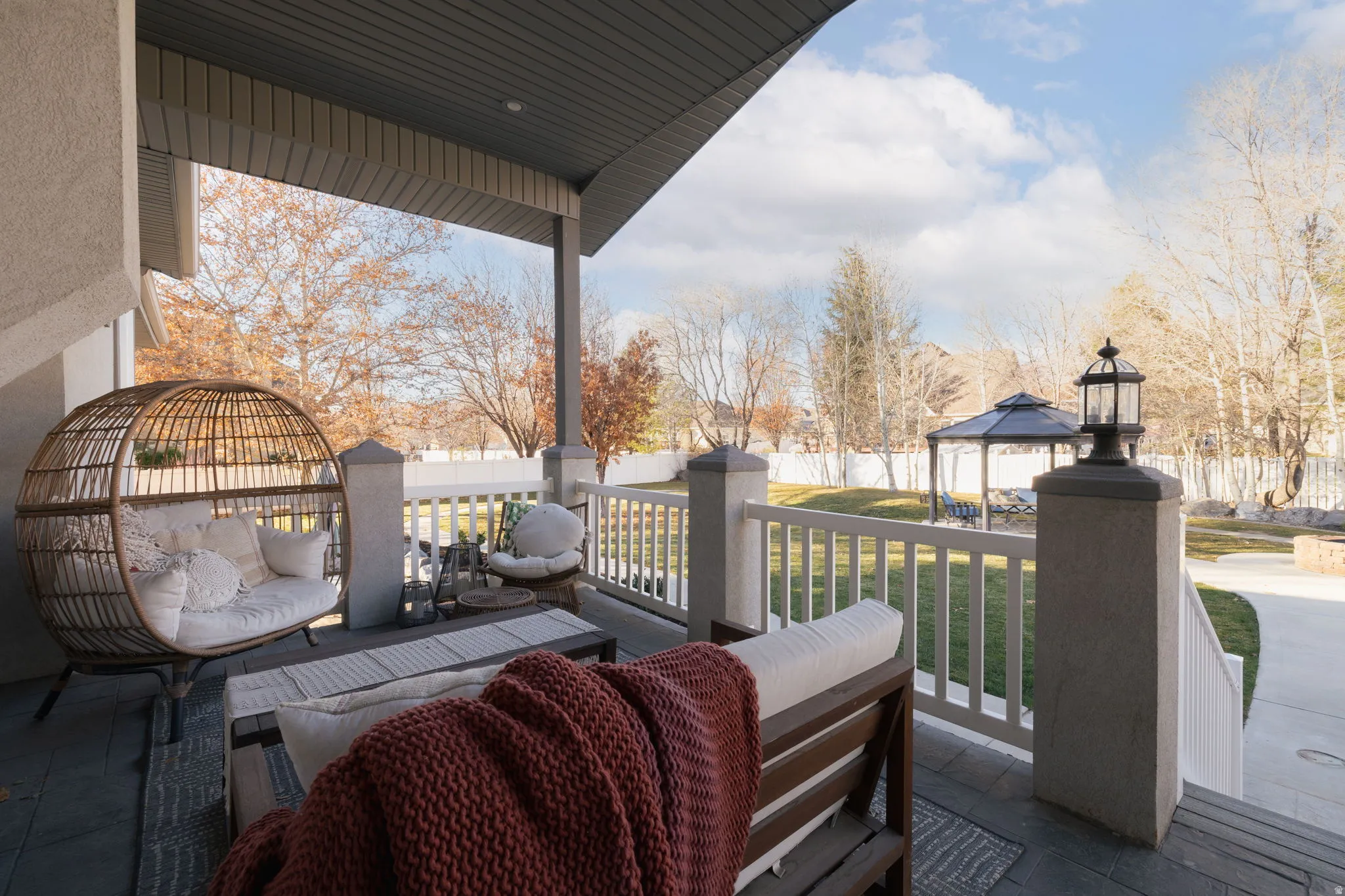 Fenced backyard with outdoor furniture