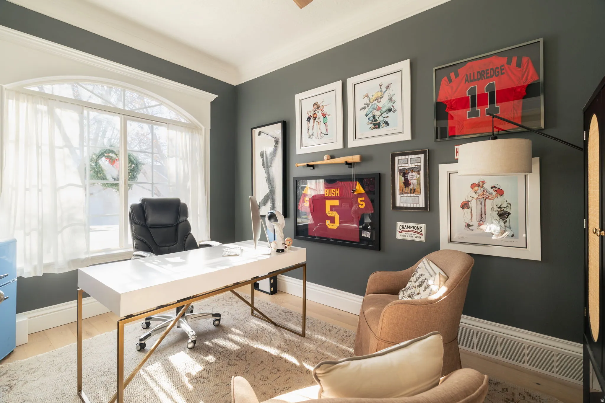 Office area with wood finished floors and ornamental molding