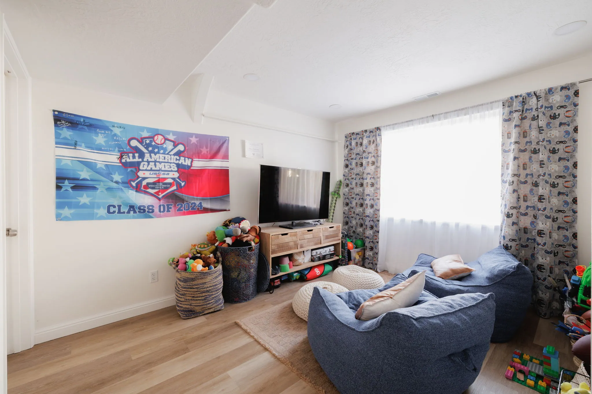 Living area with wood finished floors and baseboards
