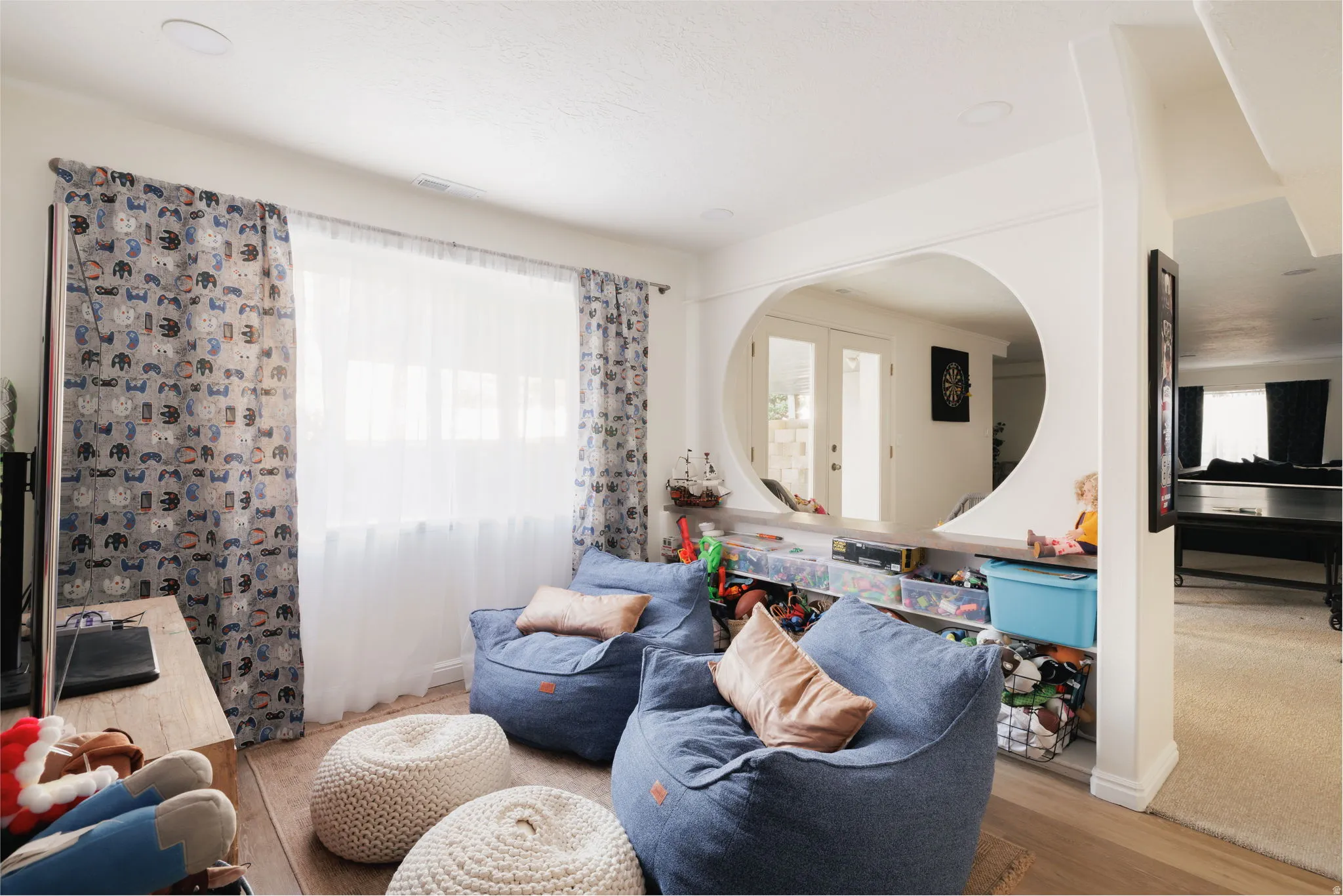 Living area featuring healthy amount of natural light and light wood-type flooring