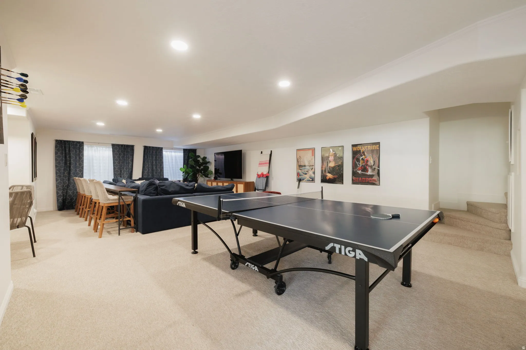 Recreation room featuring recessed lighting and light carpet