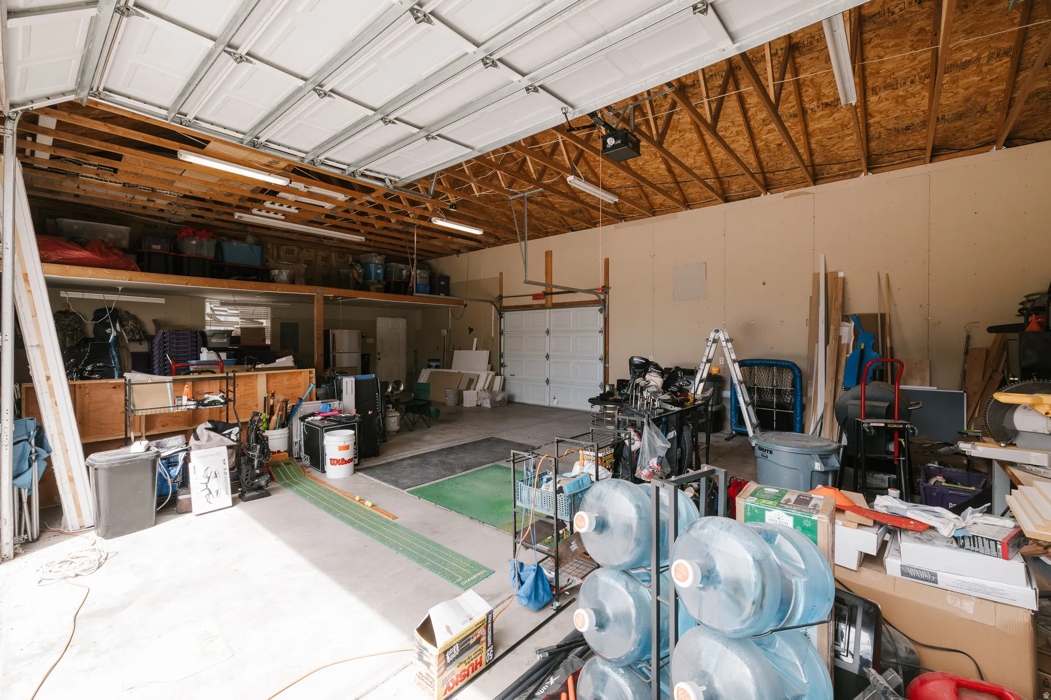 Garage featuring a garage door opener