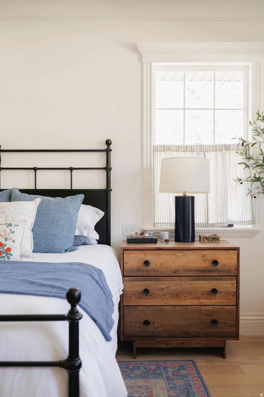 Bedroom featuring multiple windows and light wood-type flooring