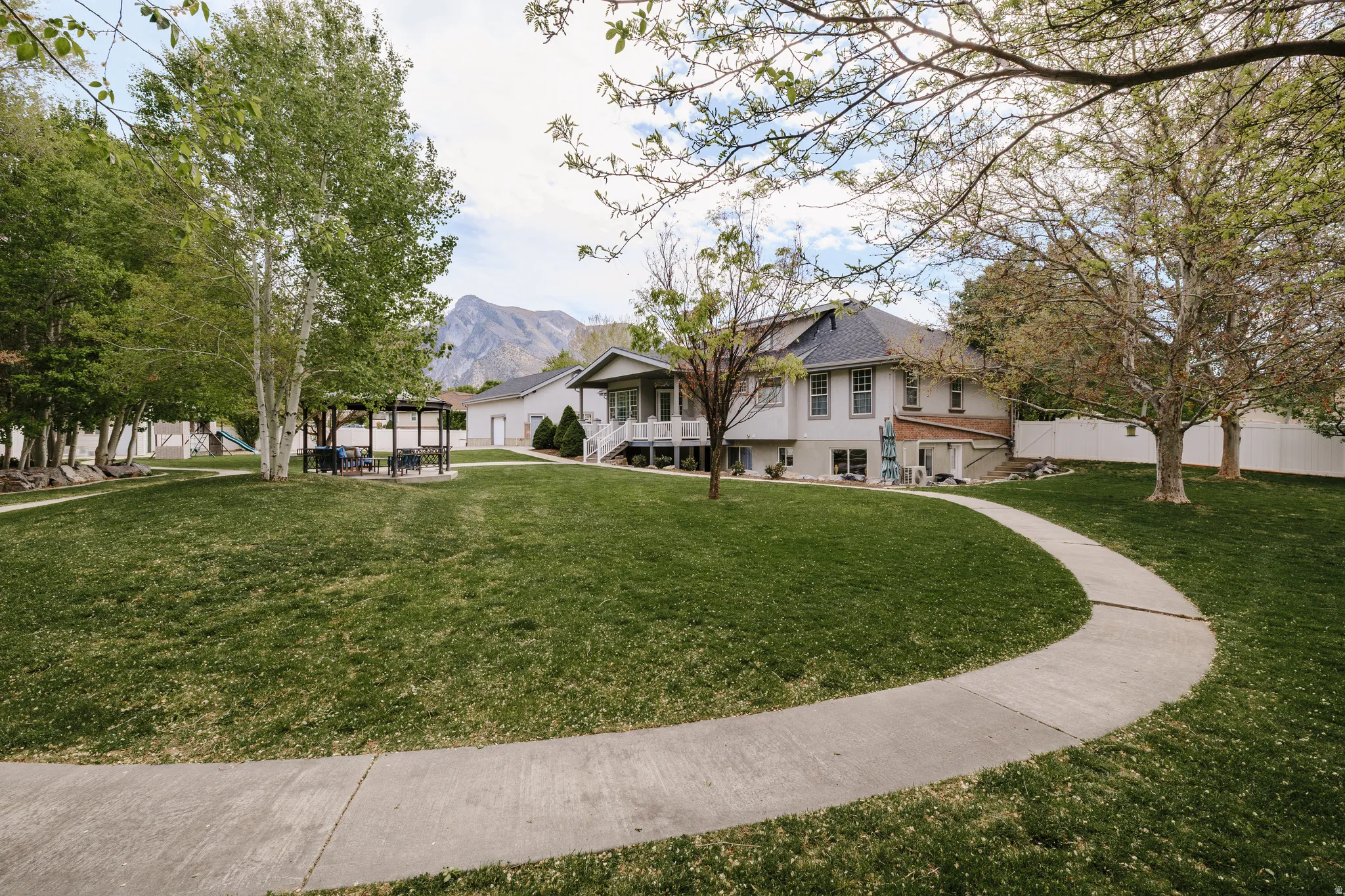Surrounding community with a mountain view and stairway