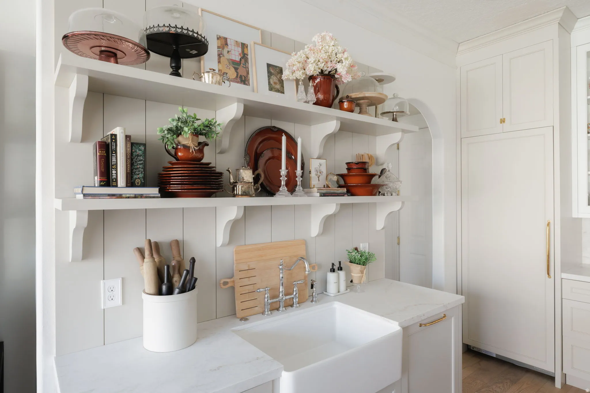 Detailed view of paneled refrigerator and crown molding
