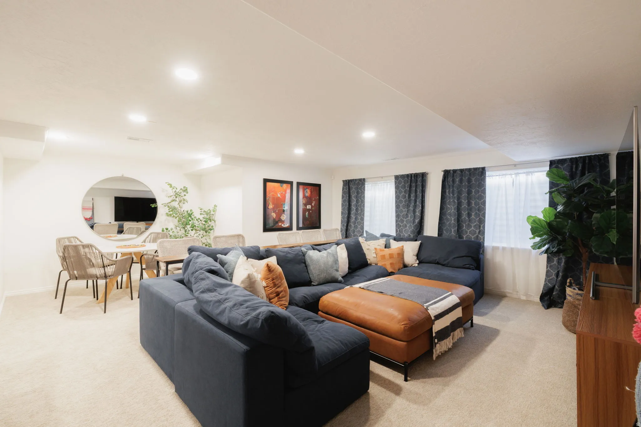 Living room with light colored carpet and recessed lighting