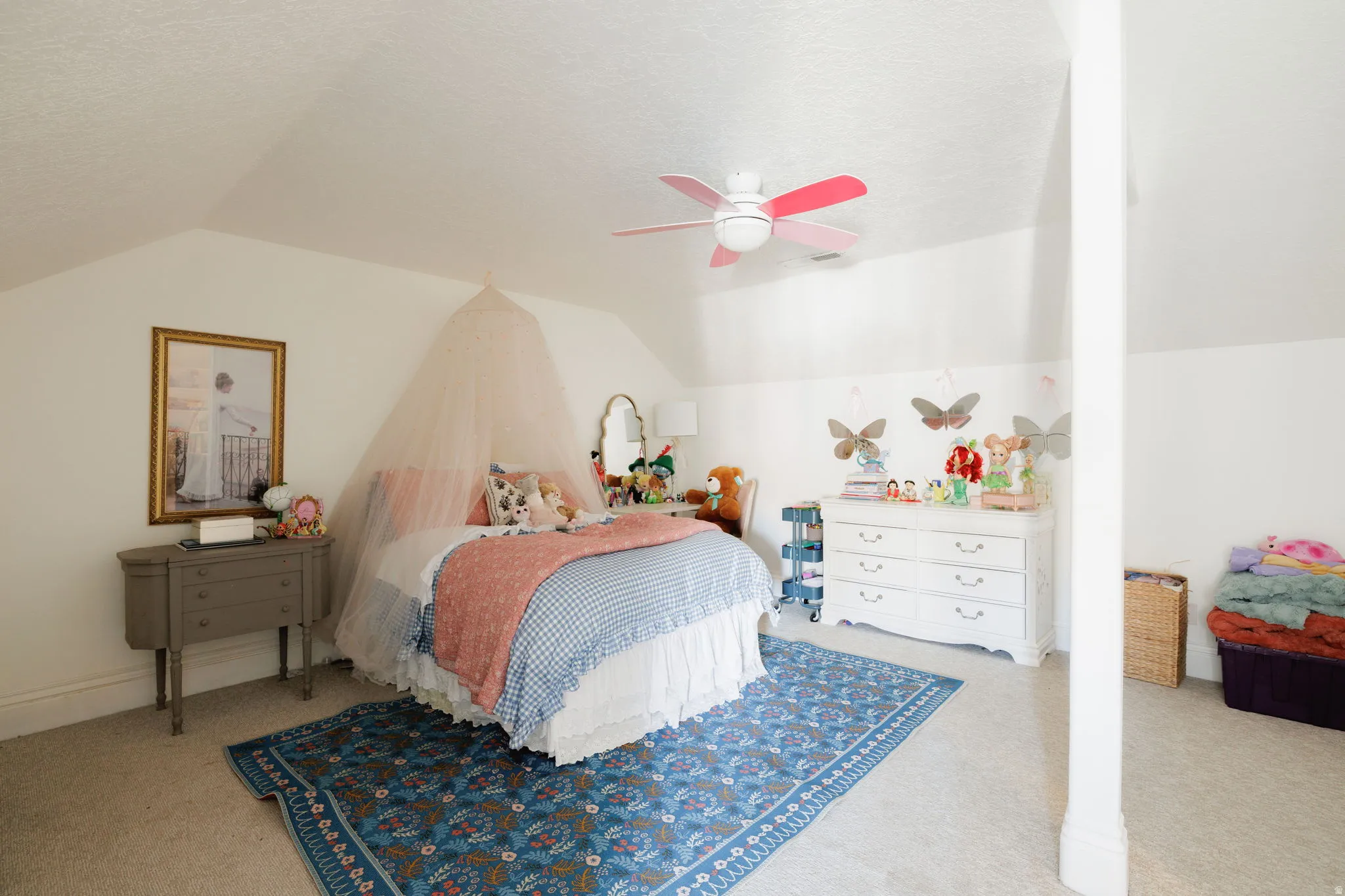 Bedroom with light colored carpet and a ceiling fan