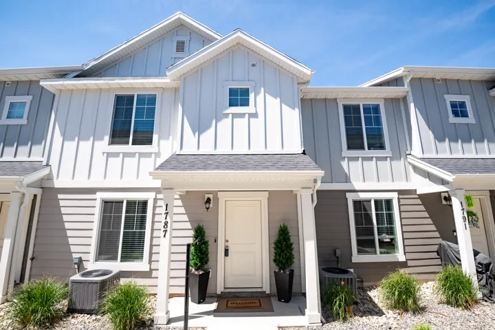 Two-tone exterior with vertical board and batten siding and horizontal lap siding