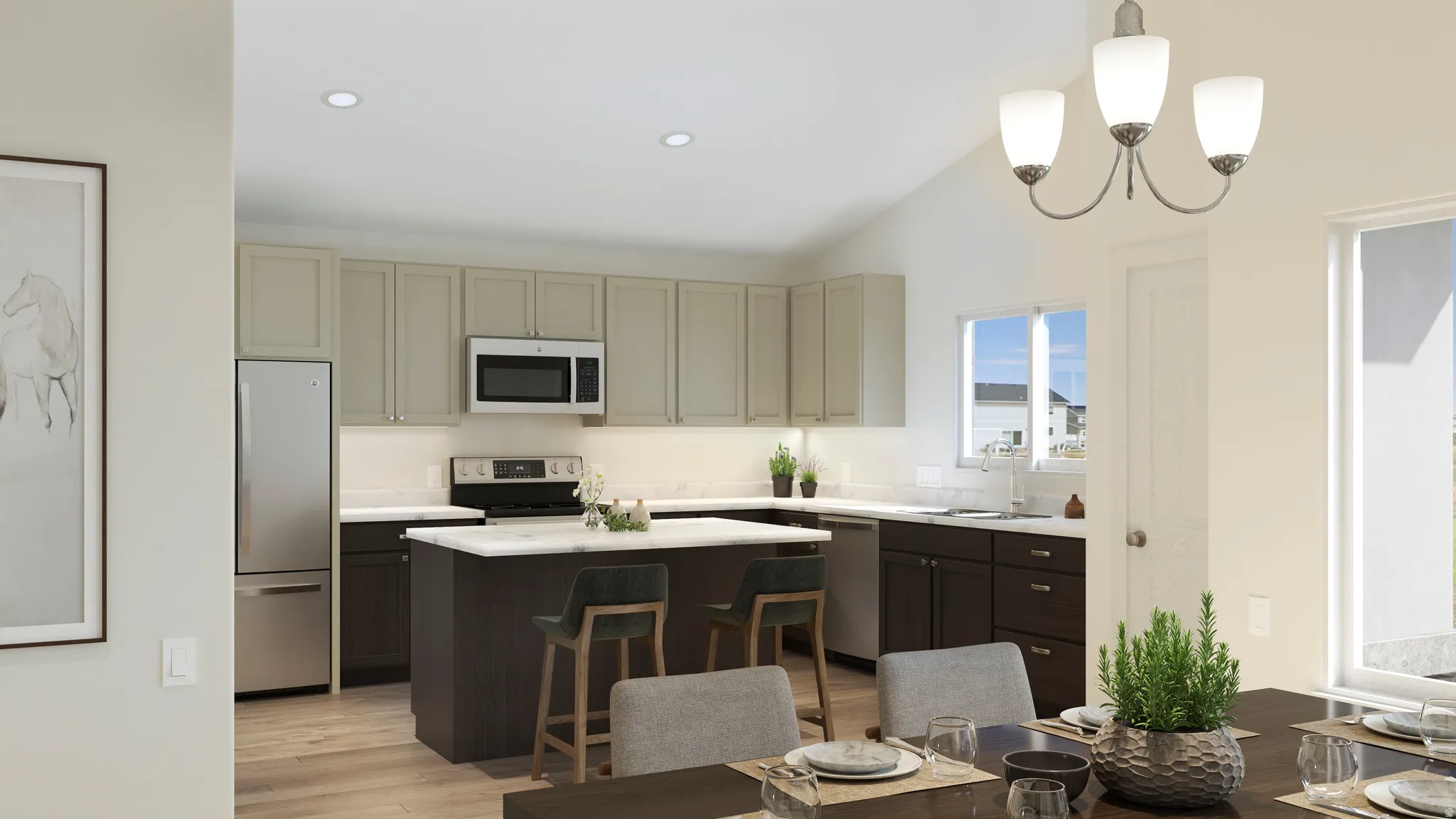 Modern kitchen featuring a two-toned cabinetry scheme, a central island with countertop seating, stainless steel appliances, and wood-finish flooring