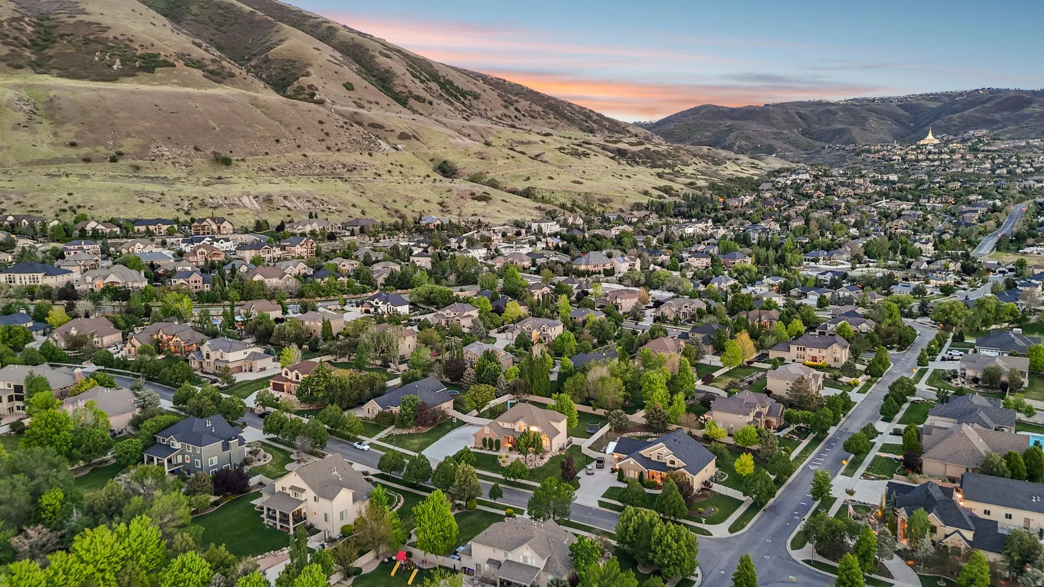 Expansive residential area nestled at the base of a mountain range