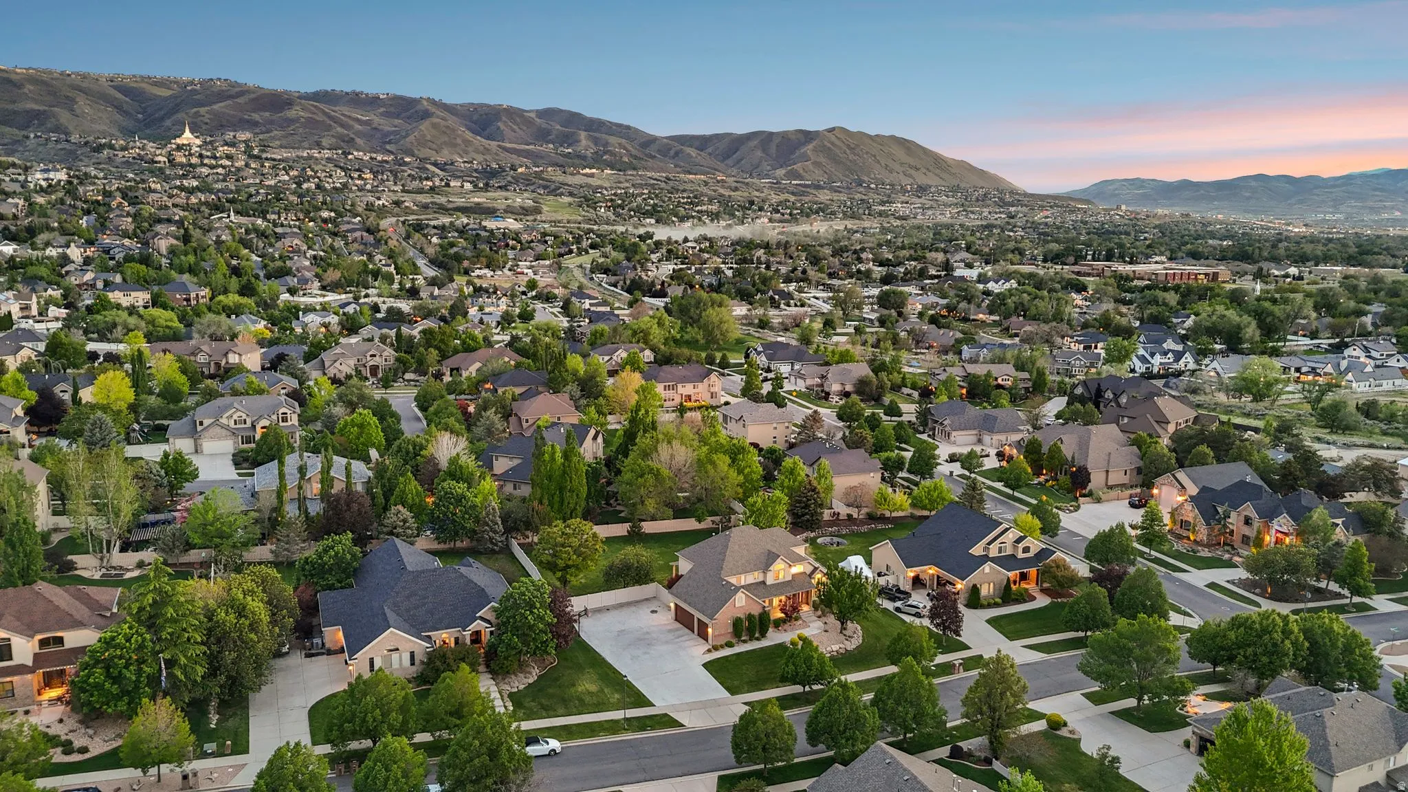 Aerial perspective showcasing a residential area with varied home styles and mature landscaping