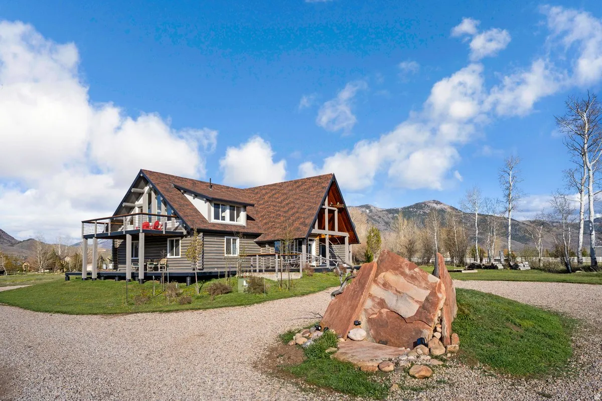 Mountain chalet-style residence featuring a prominent A-frame architectural element