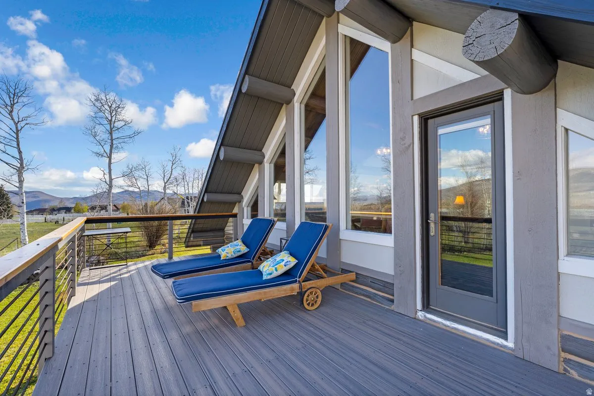 Expansive deck featuring composite decking and a cable railing system