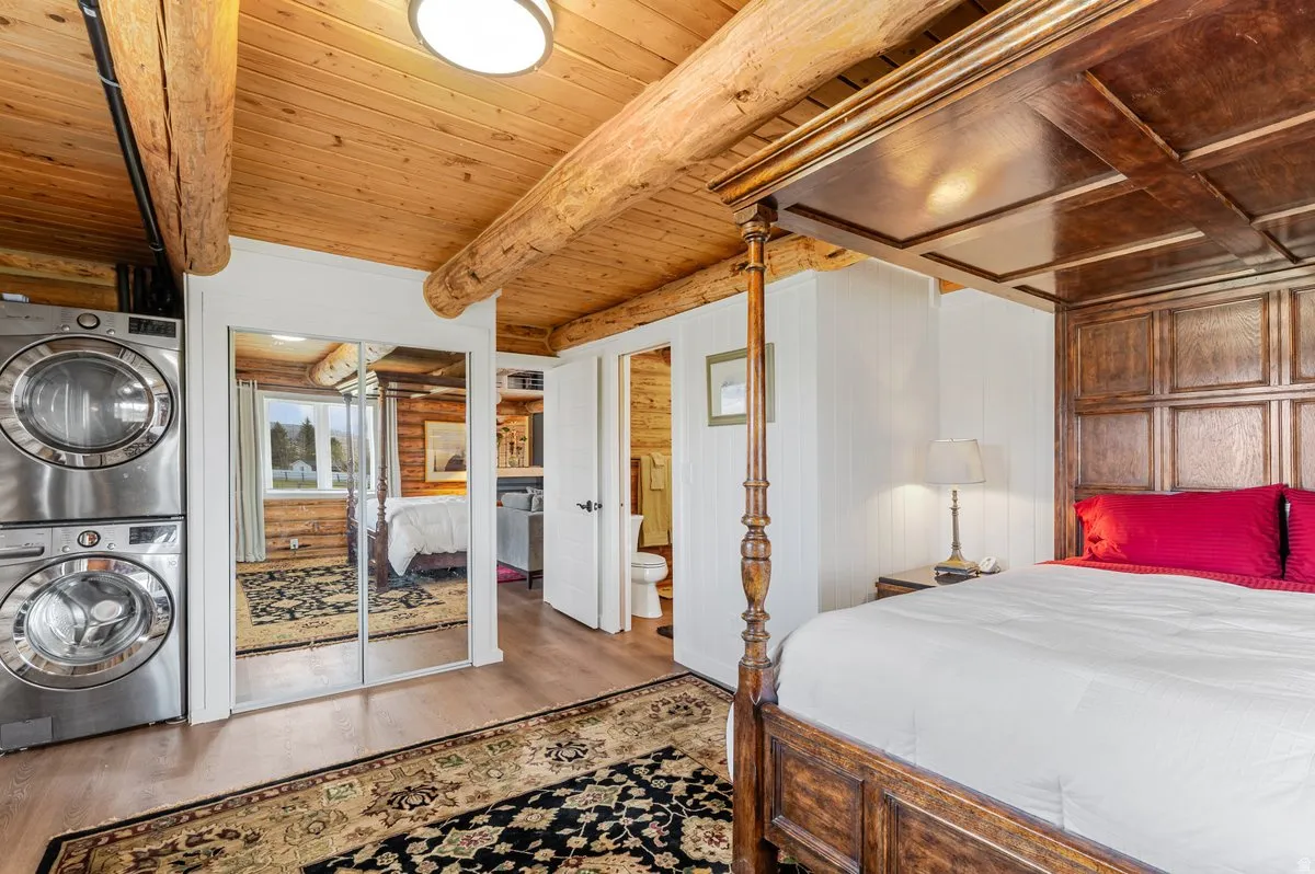 Vaulted wood-paneled ceiling with exposed log beams