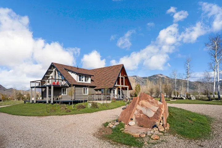 Mountain chalet-style residence featuring a prominent A-frame architectural element