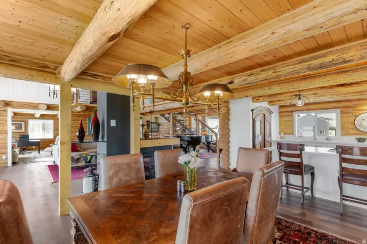 Dining area featuring an ornate chandelier over a large wood-finish table