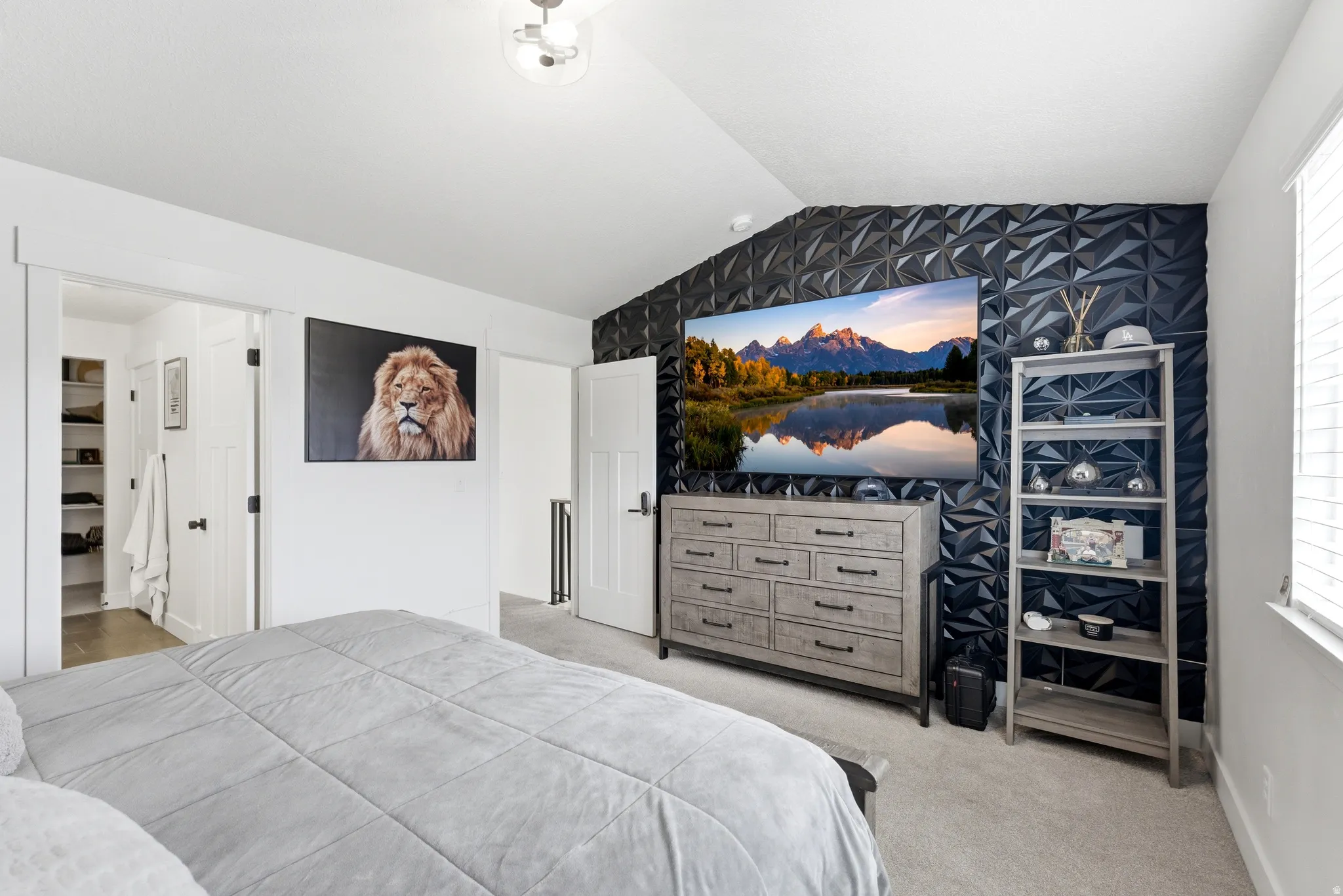Accent wall with geometric paneling and mounted television