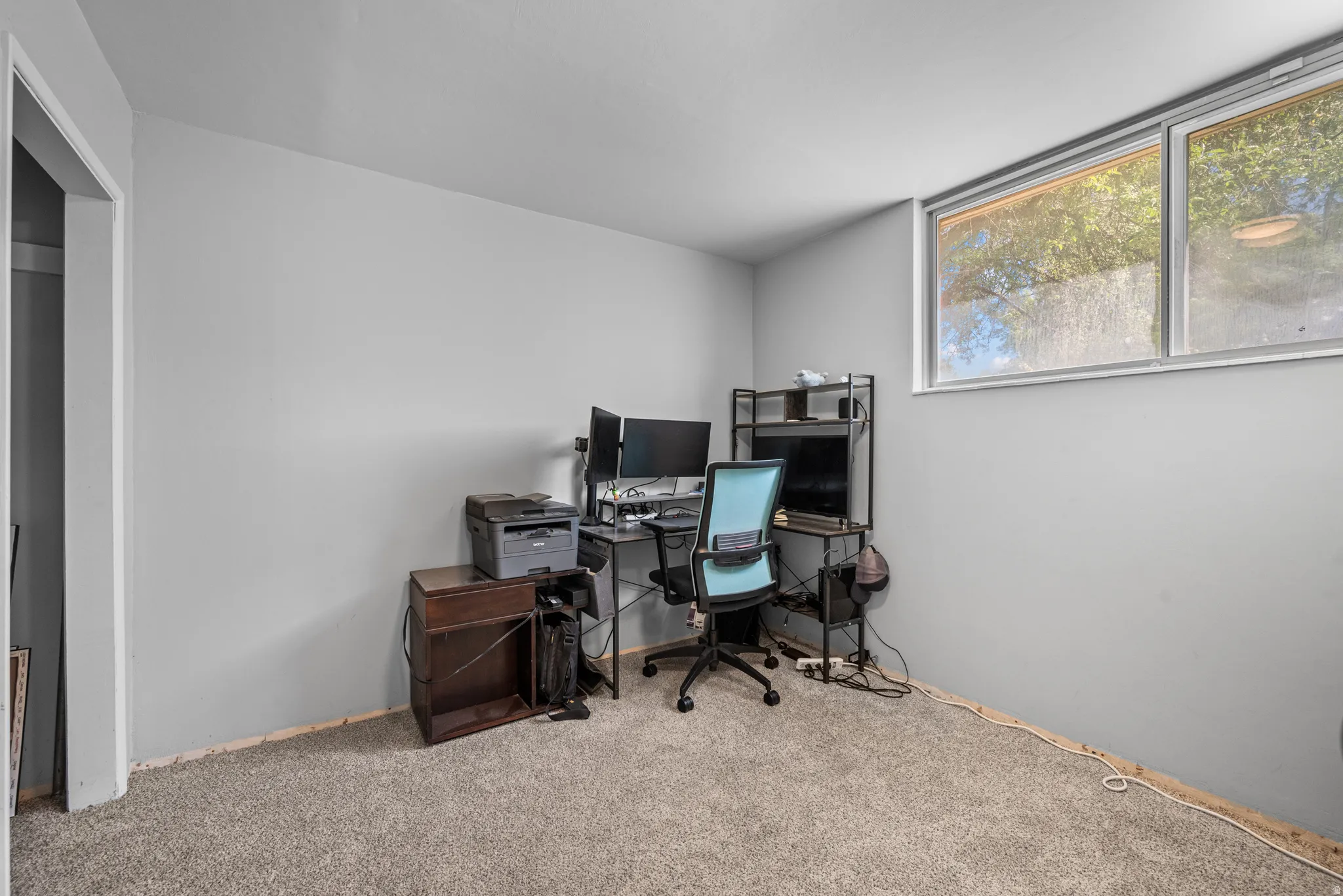 Room featuring grey wall paint and light-colored carpeting