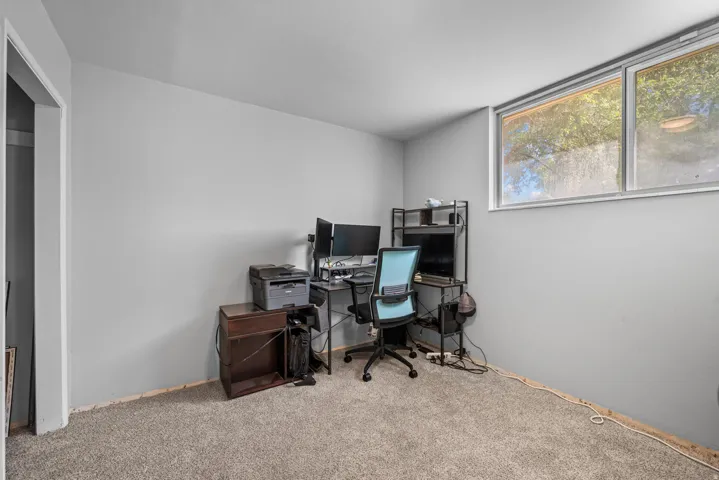 Room featuring grey wall paint and light-colored carpeting