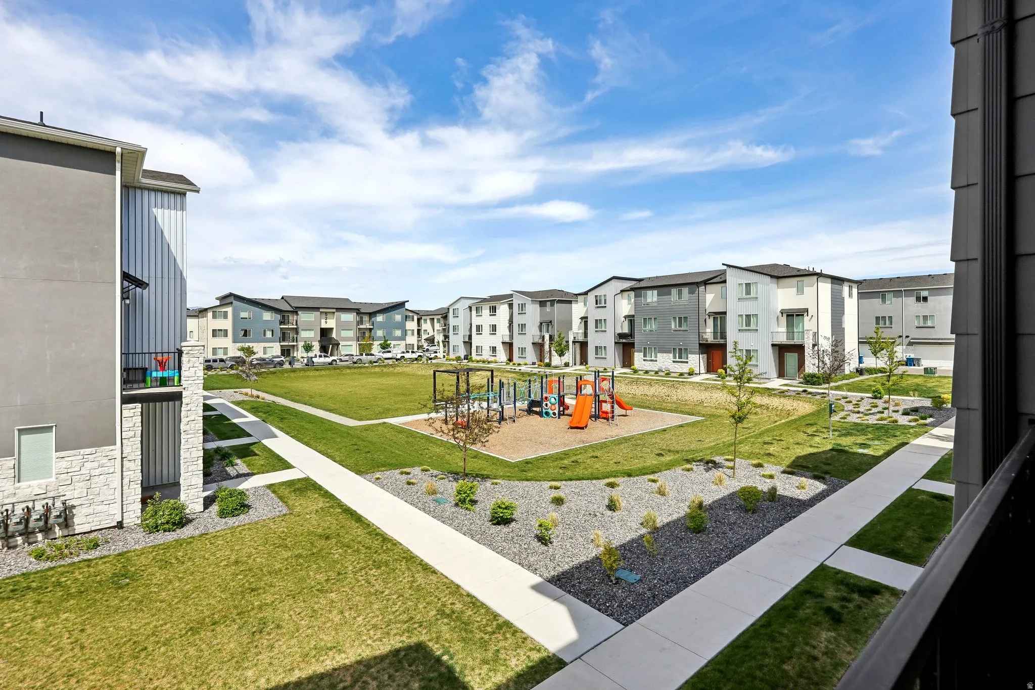 Community jungle gym with a lawn